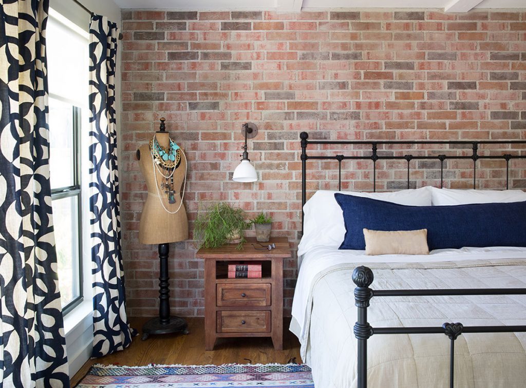 Austin interior design eclectic bedroom with exposed brick