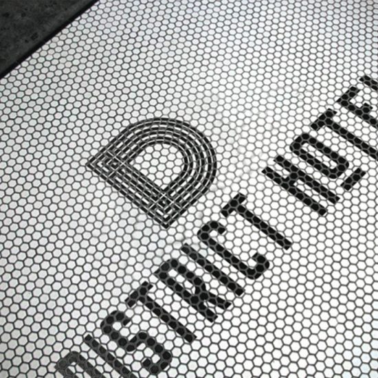 The District Hotel logo made of tiles, created by Round Table Design as hospitality design project.