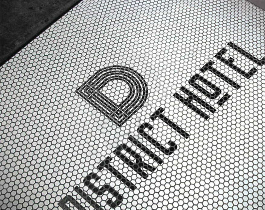 The District Hotel logo made of tiles, created by Round Table Design as hospitality design project.