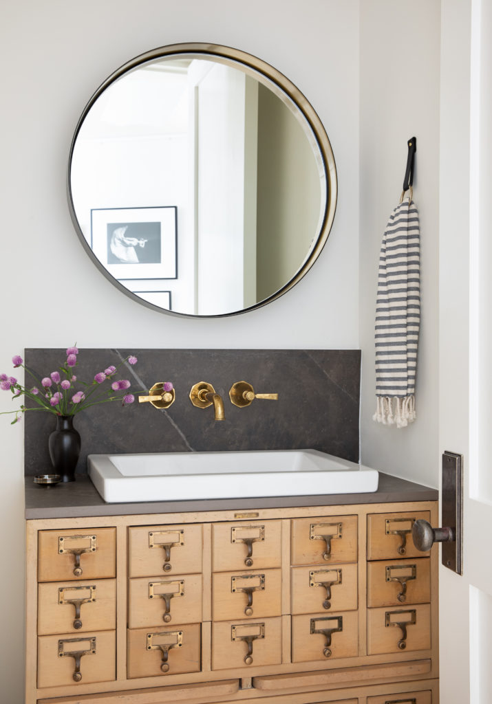 Custom vanity made from vintage library card catalogue